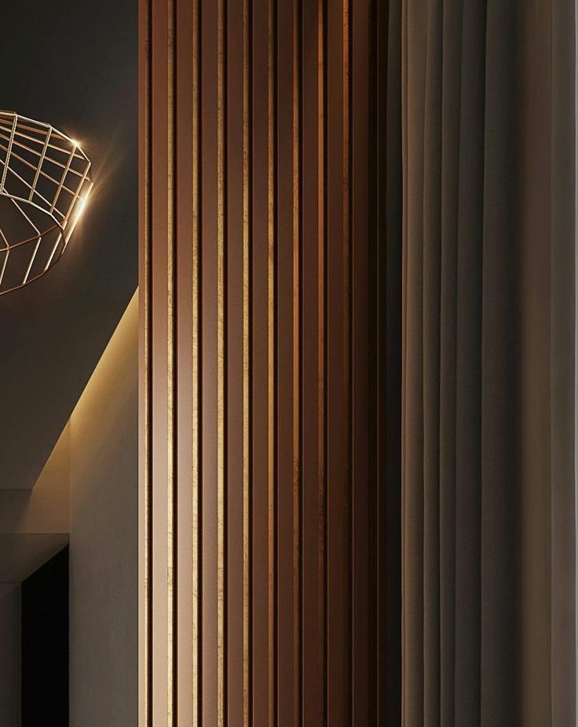 Close-up of a stylish wooden panel with vertical grooves and elegant lighting, showcasing modern interior design elements.